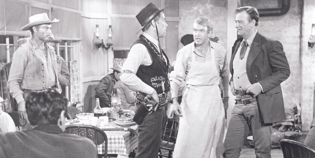 Von links: Lee van Cleef, Lee Marvin, James Stewart und John Wayne. Einer von ihnen ist "Der Mann der Liberty Valance erschoss" Und einer ist Liberty Valance.