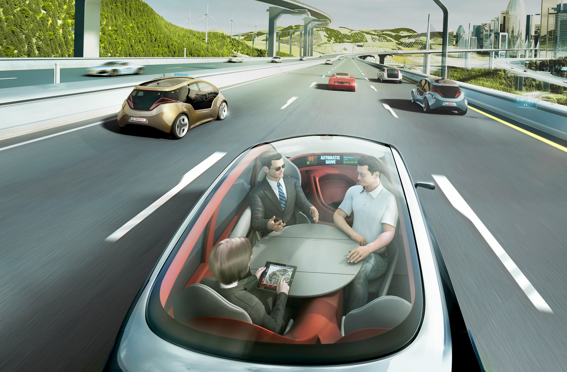 Beim vollautonomen Fahren braucht man weder Lenkrad noch Pedale. Im Wagen sitzen Passagiere, die Videos schauen können und nicht auf den Verkehr achten müssen.
 Foto: Bosch