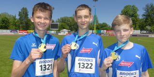 Strahlten über Gold (von links): Elias Kelm mit den Cousins Konstantin und Sergey Zhabitskiy.