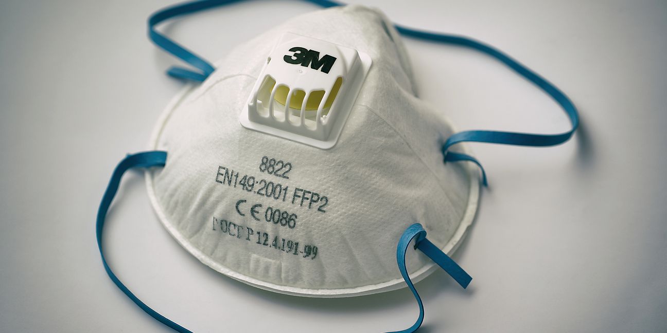 Paris, France - 27 MAR 2020: 3M trademark FFP2 class certified filter mask lying on white background. Protection from firm and fluid , largely used against medical risk like bacterias and virus, included Covid-19.