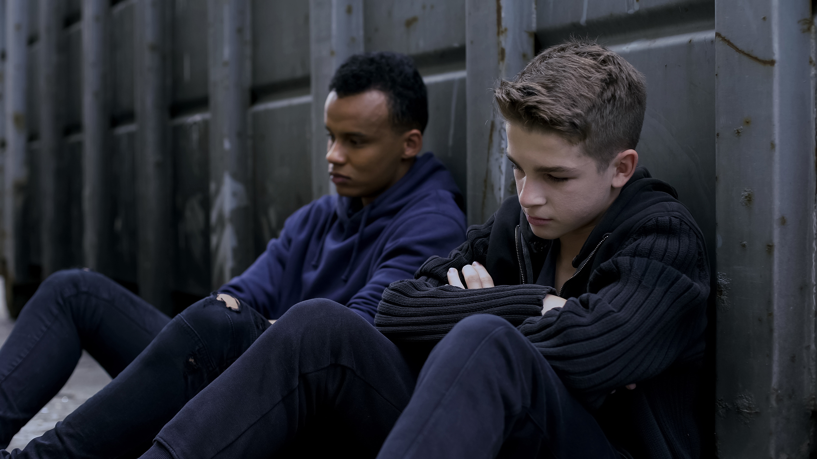 Depressed teenagers escape from orphan home, hiding on backstreet, hopelessness