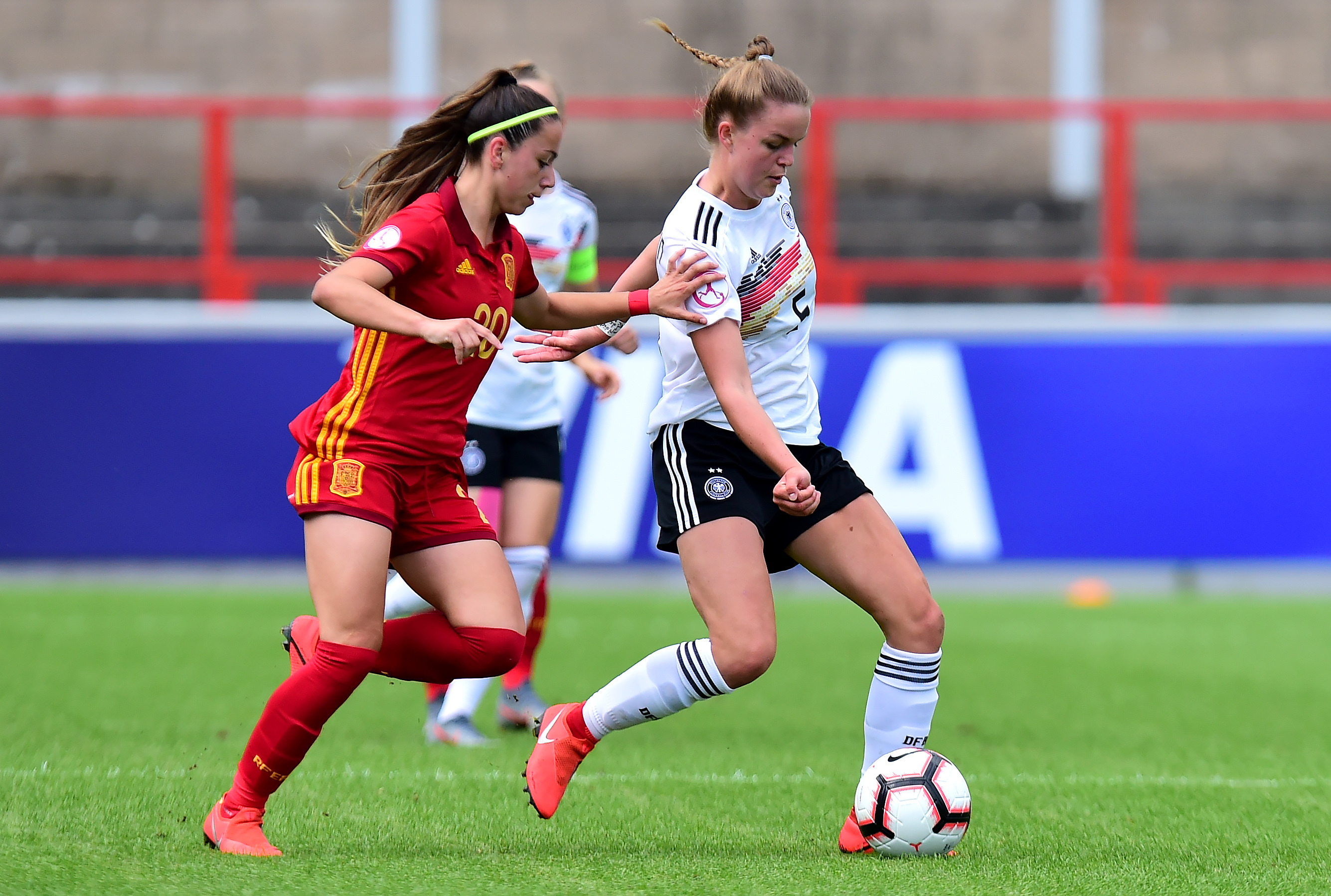 STIRLING, SCOTLAND - JULY 22: Greta Stegemann of Germany takes on Athenea del Castillo of Spain during the UEFA Women's Under19 European Championship match between Spain Women's U19 and Germany Women's U19 at Forthbank Stadium on July 22, 2019 in Stirling, Scotland. (Photo by Mark Runnacles/Getty Images for DFB)