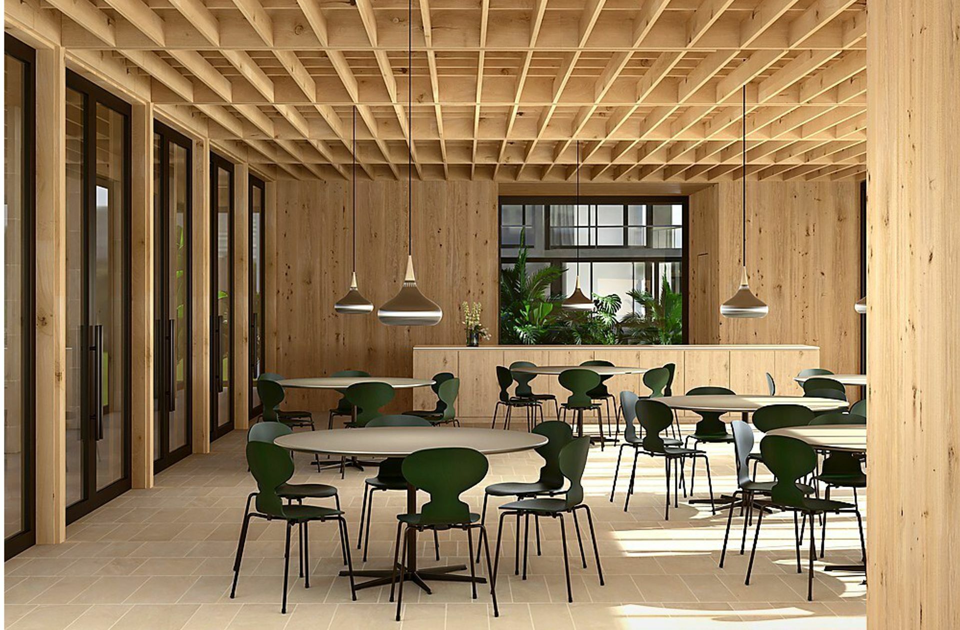 Wie Muuto ist auch die Firma Fritz Hansen aus Dänemark – und bewirbt die Arne-Jacobsen-Stühle „Ameise“ in einem hölzernen Umfeld. Damit  selbst die Lobby oder die Kantine warm und gemütlich wirkt.