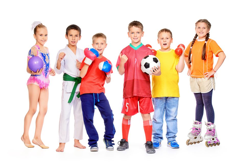 Sports and activities for children. Group of joyful boys and a girls engaged in various sports posing together. Education. Isolated over white background.